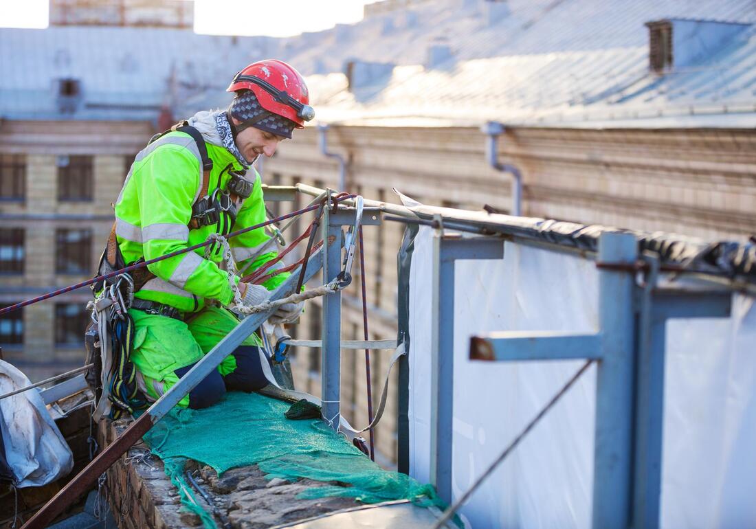 commercial roofing worker working